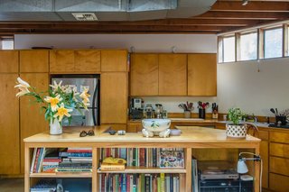 The house is made of simple off-the-shelf materials. The beams are standard two-by-fours and the floors on the first level are polished concrete. 