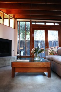 Kristin, who often creates custom projects for private clients, designed the Horizon coffee table as a birthday gift for William. Its glass and teak are meant to recall the materials in the house.