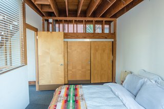 The second floor is home to a simple bedroom. 