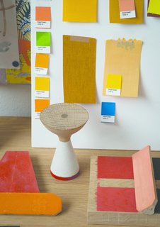 Color samples surround a model of Pinch's fisherman-inspired Float table. 