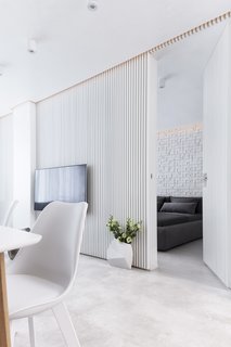 Instead of paint, the walls are embellished with MDF to create interesting surface textures.