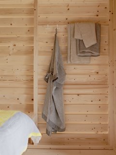 Koti guests are greeted with a robe and slippers by Lapuan Kankurit, a textile company run by fourth-generation weaver.
