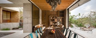An Eco-Friendly Getaway Built With the Future in Mind - Photo 5 of 7 - Thanks to the temperate climate, living and dining areas are able to be open to the surrounding environment.