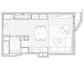 STADT Architecture's renovation created more living space without sacrificing functionality. The bathroom was moved to the back of the apartment, opening up square footage for a dining area off the galley kitchen.