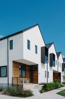 Sustainability is the Centerpiece of This New Austin Development - Photo 2 of 6 - Organized in two rows of four houses each, the Tilley Row Homes make a modernist statement with the rhythmic repetition of their gabled roofs. 