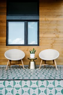 Sustainability is the Centerpiece of This New Austin Development - Photo 3 of 6 - While the structures are virtually identical, details like the colorful tiles on the porch set each house apart from its neighbors. 