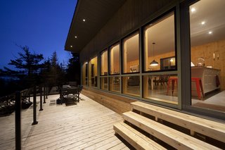 Save for a deck a few steps below the main living space, the home is conceived as a single volume. 