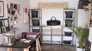 Fashion designer Lindsey Lund Mortensen’s half of the studio showcases some of her creations as well as an inspiration board. 