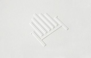 The silhouette of an Adirondack chair, seen here on embossed stationery, references the store’s resort town setting. 