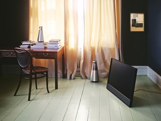With a similar aluminum casework to BeoSound 1, BeoSound 2 is distinguished by a vertical grille. Slightly larger and more powerful than its counterpart, it requires a permanent power connection. 