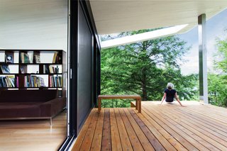 Is it Any Surprise a Sculptor Had a Hand in This Home? - Photo 2 of 4 - A covered terrace is accessible from the second floor. An oculus allows the residents to sun beneath the roof overhang. 