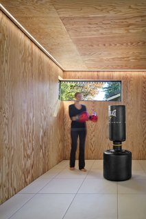 Cling to Summer a Little Longer at This Indoor Oasis - Photo 2 of 3 - A box contained within the addition provides space for exercise. The interior is wrapped in marine-grade plywood. 