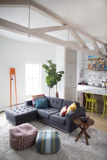 The living room features an eye-catching Tiuku grandfather clock by Covo. The Gus sofa is from Lekker. The flooring is new. 