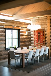 A traditional tapestry and other textile accents warm the home. The chandelier is by Kalmer. 