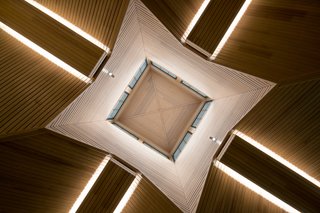 The cathedral-like, wood-paneled ceiling makes a big impression in the foyer. 