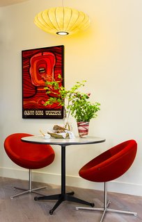 After Sandy, an NYC Designer Rehabs His Ruined Apartment—and Lends Neighbors a Hand with Theirs - Photo 1 of 4 - After Superstorm Sandy in 2012, architectural designer Daniel Ian Smith revamped his garden apartment in Manhattan’s West Village over nearly two years. The original George Nelson lamp is an heirloom from his great aunt. The Soviet-era theater poster is from Poland. 