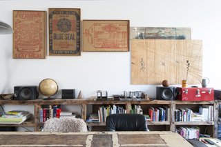 New York designer/artist Huy Bui decorated his home with a mishmash of curios, from 19th-century burlap sacks found at an antique fair to a plywood workbench he carved with a Festool plunge saw. The 17-foot-long shelving unit is made of old heart pine fashioned from the beams of a brownstone renovation he worked on in the West Village. 
