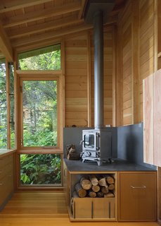 While the space is heavily insulated, with strong solar gain, a cast-iron stove from Salamander Stoves provides extra warmth on cool days. 