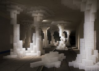 The units are comprised of 27 spheres. Held together by hot glue, the units can connect to each other by Velcro fasteners at the corners. 