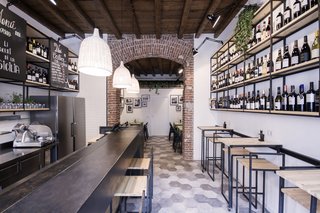 Bringing a Taste of
Sicily to Milan - Photo 1 of 5 - Studio DiDeA maximizes the use of the restaurant’s limited square footage by utilizing all aspects of the space for storage, dining, drinking, or display purposes. 