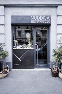 Bringing a Taste of
Sicily to Milan - Photo 5 of 5 - Previously a tailor’s shop located in the heart of Milan, Muddica has been converted into a restaurant, bar, and Sicilian deli. 
