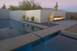 Instrumental in extending the new spa-like qualities to the outdoors was the decision to demolish the original leaking, kidney bean-shaped pool that crowded the backyard. Now taking its place is a new, blue glass tiled pool and floating concrete pads which provides an enticing and refreshing focal point for the interior family spaces. Eliciting the harmonious and serene light qualities of a cloud's interior, the spaces are now more functional and peaceful.