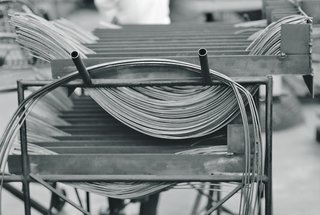 Making Bertoia - Photo 2 of 14 - The stainless steel metal rods used in the assembly of the Bertoia Collection. Image from the Knoll Archive.