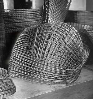 Making Bertoia - Photo 12 of 14 - Finished Bertoia Diamond Chair frames stacked and awaiting assembly. Image from the Knoll Archive.