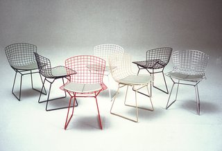 Bertoia Side Chairs shown in green, blue, white, red, white, yellow, black and chrome colorways. Image from the Knoll Archive.