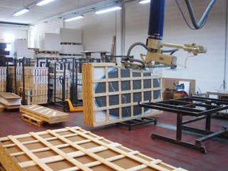 Quarry to Table: A Story in Stone - Photo 12 of 13 - Finished marble tops being crated and prepared for shipment.