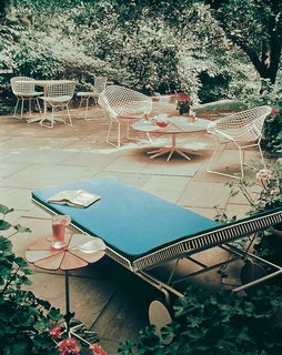 The Petal Collection accompanied by Harry Bertoia's Diamond and Side Chairs. Photograph from the Knoll Archive.