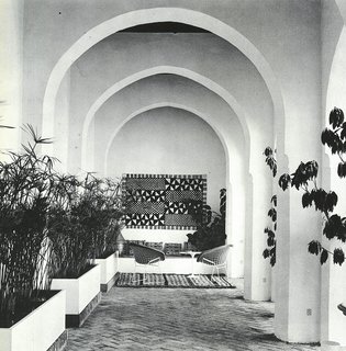 Looking down one of the arcades around the central courtyard, lined with papyrus plants and Berber rugs. 
