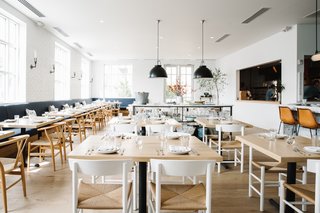 A Women-Run Restaurant in Nashville Invites Visitors to Just Have Fun - Photo 2 of 6 - "We wanted it to feel like it could be anywhere on the beach, whether it's California, Charleston, the Hamptons, or the South of France," Lager says. Nashville's Five String Furniture built the tabletops and service table. 
