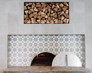 A Women-Run Restaurant in Nashville Invites Visitors to Just Have Fun - Photo 5 of 6 - The six-foot wood-burning oven features the same sunburst tile as the floors. 