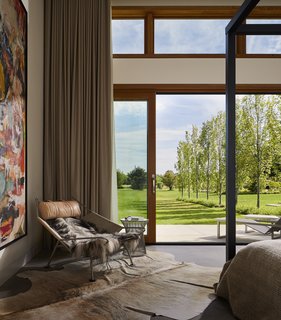 Harouna Ouedraogo artwork, the same artist shown in the dining room, is also showcased in the master bedroom. 