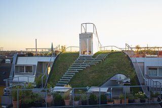 Because the open space is owned by everyone in the building, De Smedt wanted it to feel that way. "The new penthouses open to it naturally, and the existing common stairs open to it equally naturally," he says. "We wanted that space to be very accessible so that anyone would just pop up there without hesitation."