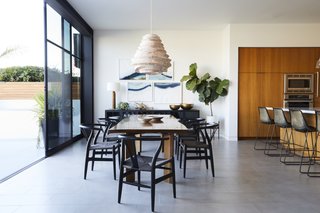 "The owners really wanted to make sure that the furniture was inviting and interesting, but still felt like it fit the space," DeSanti says. "Martha designed a great open space, but without the furniture the space could have felt very cold." France and Son supplied the chairs around the custom dining table, and the chandelier was spotted at Roost. 