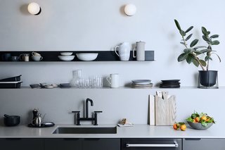 "We were excited to infuse the space with cozy, dark cabinetry and appliances, to make it a little moodier than our light and airy main kitchen," Stubbs says. 