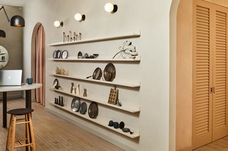 Open shelving is a staple of Food52, and here, it can be a versatile place to display tools and artwork. "Most of what we did was dedicated to flexibility and storage that shows off products, so we had to make sure that every square inch was attractive and pragmatic," Sherman says. 