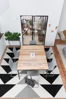 A Venice Beach Abode Becomes a Chic Coliving Space Where Everything's For Sale - Photo 2 of 7 - Geometric patterns were a big part of the home's design, and that's best showcased by the dining room's "Martini Up" area rug by Flor. 