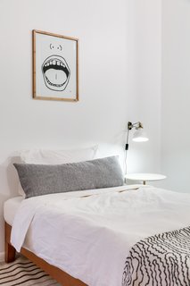A Venice Beach Abode Becomes a Chic Coliving Space Where Everything's For Sale - Photo 7 of 7 - The bedrooms were made to be comfortable, yet minimal, so that any visitor would feel at home. The throw at the end of the bed is sourced from Zigzag Zurich. 