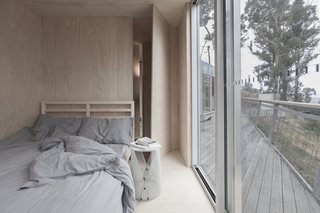 This Off-Grid Container Home in Australia Disappears in Nature - Photo 5 of 8 - The two bedrooms were made to be equally simplistic, with just enough to feel comfortable. 