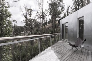 This Off-Grid Container Home in Australia Disappears in Nature - Photo 7 of 8 - A deck on the southside of the home is the perfect place to take in the ocean view. 