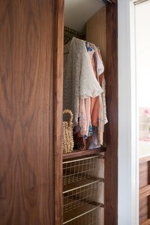 "We incorporated a lot of storage under the sofa, in the floor-to-ceiling wardrobe, in the bathroom cabinet, under the bed, and beside the bed in the nightstands," Oliver explains. "Each space was planned and designed carefully, taking what I learned about them and what they wanted."