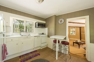 The simple kitchen is as bright and breezy as the rest of the home. 