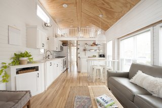"I wanted our home to have as many windows as possible," Jorie says. "I love how the plywood ceilings turned out looking so clean and natural."