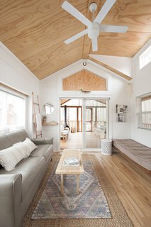 "We needed furniture that could be easily wiped down and rid of sand from the beach and dirt from our hikes; a leather sofa was a must," she says. Jorie added a daybed to the living area as an extra space to sleep, if needed. 