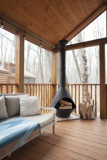 Jorie asked for an enclosed deck at the front of the home, which includes a dining area, as well as a space for the kids to sleep, if they desire. "The huge screen deck feels bigger than the interior of our home," she says. 