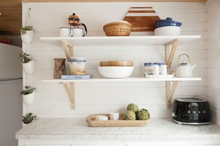 Here's the main difference between her tiny home and primary home: counter space. Jorie specifically chose this eye-catching Smeg toaster because she knew she'd "have to leave it out for all to see." 