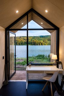 Baltic birch plywood is installed on the walls of the Mono, eliminating the need for baseboards and trim. The team wanted to make the structures as efficient as possible so that they would leave small environmental footprints. 